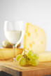 Photo: cheese and wine on a wooden table cheese and wine on a wooden table