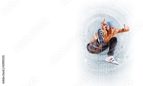 Photo: young man dancing hip hop with color lines young man dancing hip hop with color lines