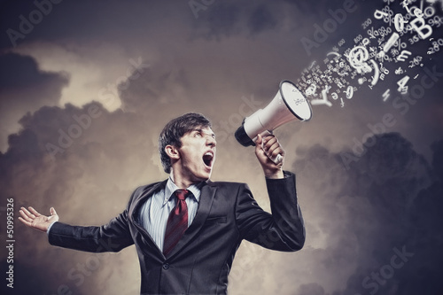 Photo: businessman with megaphone businessman with megaphone