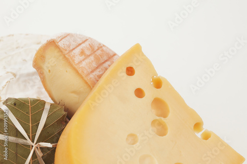 Photo: piece of cheese isolated on a white background piece of cheese isolated on a white background