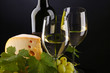 white wine and cheese on black