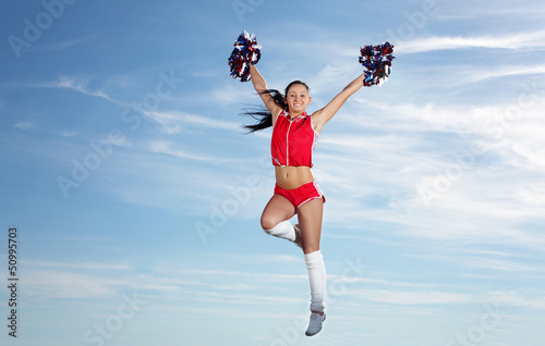 Photo: Young female cheerleader Young female cheerleader