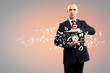 Business man holding alarmclock
