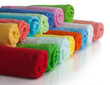 Set of colored towels on white.