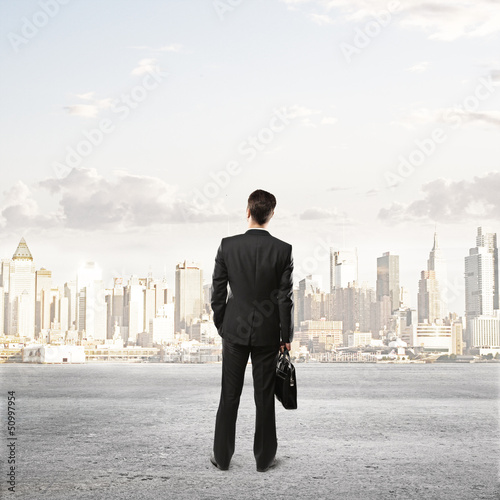 Photo: man and looking at city man and looking at city