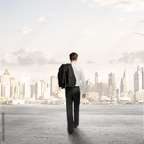 Photo: man walking to city man walking to city