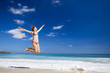 Woman jumping on the beach