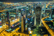 Dubai downtown night scene with city lights,