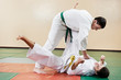 Two man at taekwondo exercises