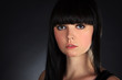 Photo: Beautiful Brunette Woman Portrait over Dark Background Beautiful Brunette Woman Portrait over Dark Background