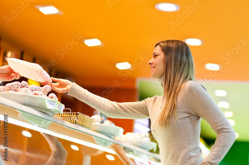 Photo: Woman shopping at the supermarket Woman shopping at the supermarket