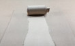Brown package paper torn to reveal white panel