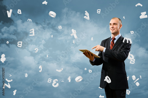 Photo: business man is working with tablet business man is working with tablet