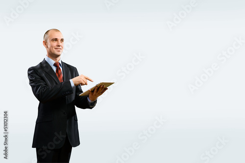Photo: business man is working with tablet business man is working with tablet