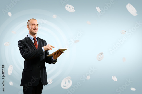 Photo: business man holding a table business man holding a table