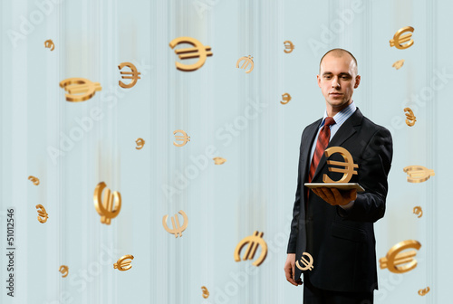 Photo: man holding tablet with euro symbol man holding tablet with euro symbol