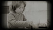 Small girl eats spaghetti, vintage 8 mm footage.
