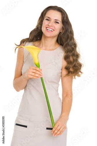 Photo: Portrait of happy young woman with flower Portrait of happy young woman with flower