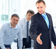 Portrait of a successful businessman giving a hand