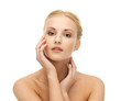 woman touching her face skin