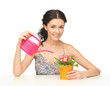Foto: housewife with flower in pot and watering can housewife with flower in pot and watering can