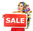 Woman holding sale banner and flower.