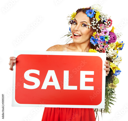 Photo: Woman holding sale banner and flower. Woman holding sale banner and flower.