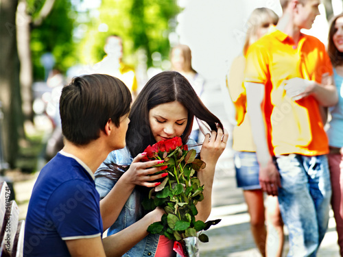 Photo: Couple of teenager on date outdoor. Couple of teenager on date outdoor.