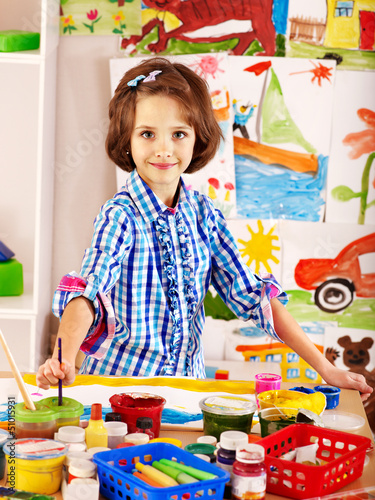 Photo: Child painting. Child painting.