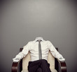 invisible man sitting on armchair