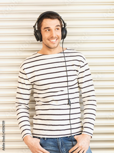 Photo: man in casual clothes with headphones man in casual clothes with headphones