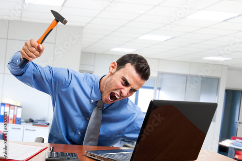 Photo: Man smashing his laptop Man smashing his laptop