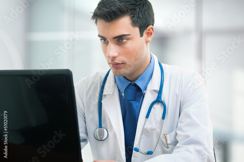 Photo: Doctor using a laptop Doctor using a laptop