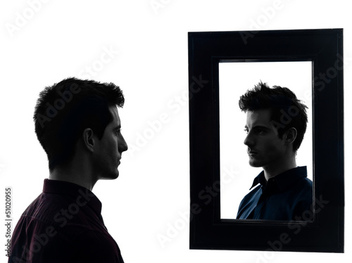 Photo: man in front of his mirror silhouette man in front of his mirror silhouette