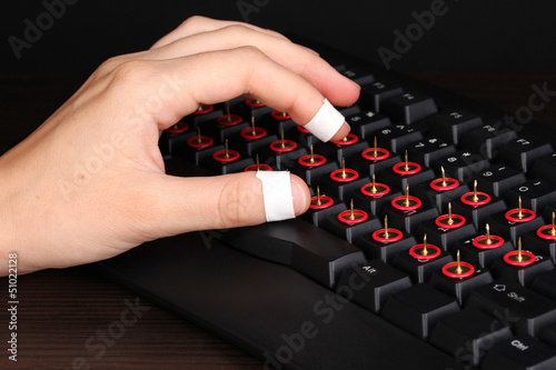 Photo: Painful typing on keyboard close-up Painful typing on keyboard close-up