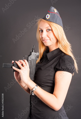Photo: Pretty woman with a gun Pretty woman with a gun