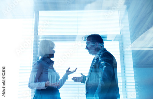 Photo: Business partners interacting Business partners interacting
