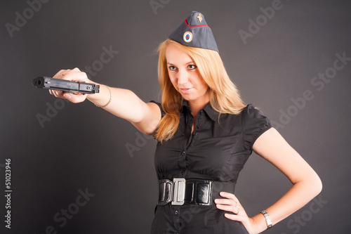 Photo: Pretty woman with a gun Pretty woman with a gun