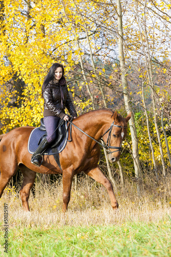 Photo: equestrian on horseback in autumnal nature equestrian on horseback in autumnal nature