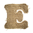 letter clipped from linen fabric