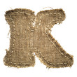 letter clipped from linen fabric