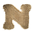 letter clipped from linen fabric