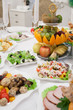Foto: Served table with appetizers in restaurant with fruits Served table with appetizers in restaurant with fruits