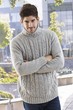 Happy man standing arms crossed