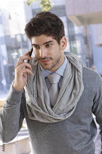 Photo: Portrait of confident businessman on phone call Portrait of confident businessman on phone call