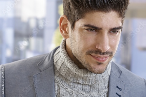 Photo: Closeup portrait of goodlooking young man Closeup portrait of goodlooking young man