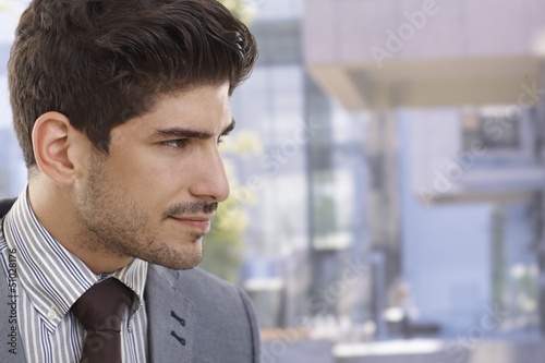 Photo: Profile of handsome businessman outdoors Profile of handsome businessman outdoors