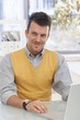 Happy businessman working at desk