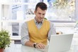 Photo: Young businessman working with laptop computer Young businessman working with laptop computer