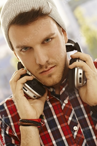 Photo: Closeup portrait of young man with headphones Closeup portrait of young man with headphones